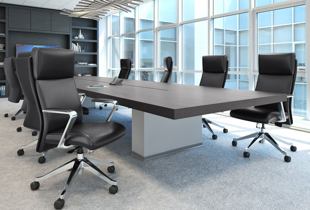 Black leather office chairs around conference table